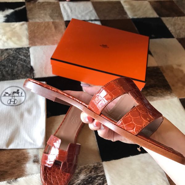 HERM Oran Slide Sandals In Orange Shiny Niloticus Crocodile Skin