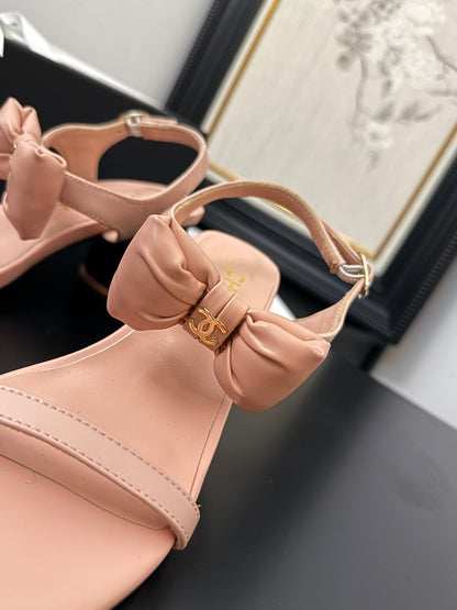 MID HEEL SANDALS IN PEACHY PINK CALFSKIN WITH BOW